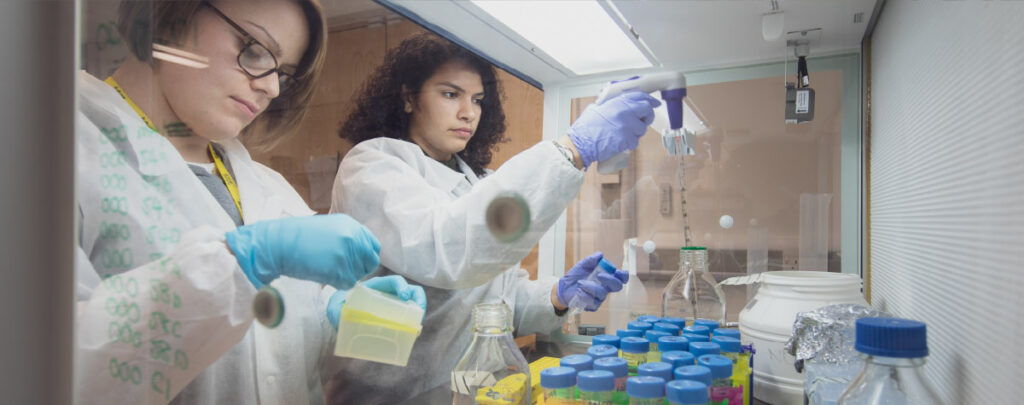 Close up of two people working in a lab