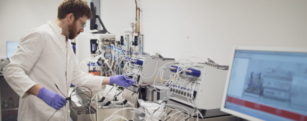 Person working on lab equipment